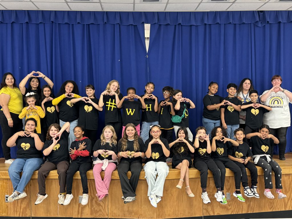 the student dancers and staff are posing on stage