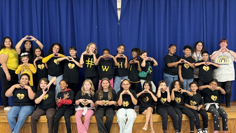 the student dancers and staff are posing on stage