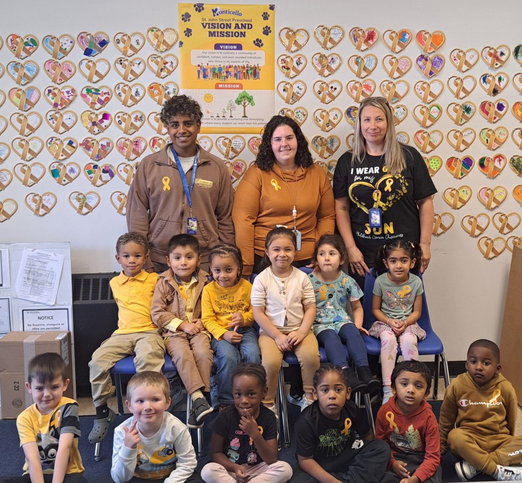 a group of students and teachers are posing