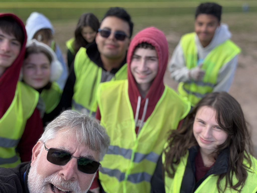 selfie of the students at the litter pluck with their advisor. 