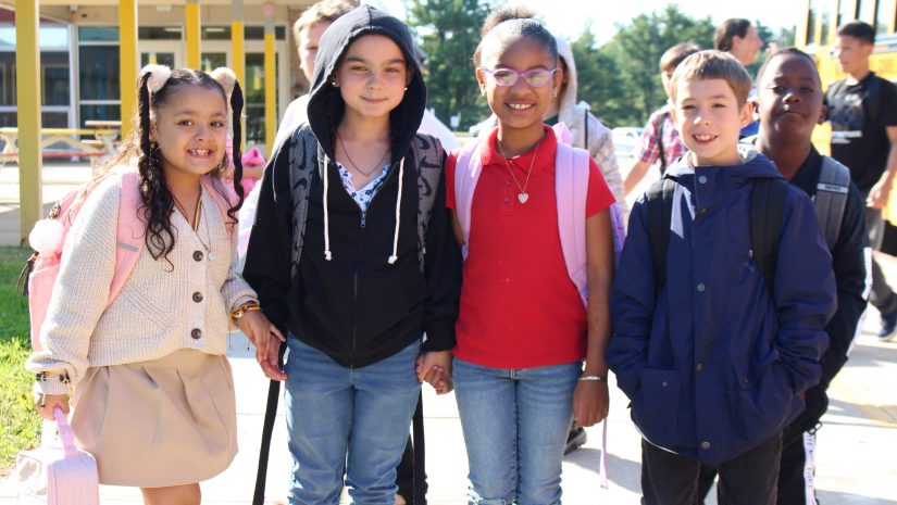 a group of students are posing