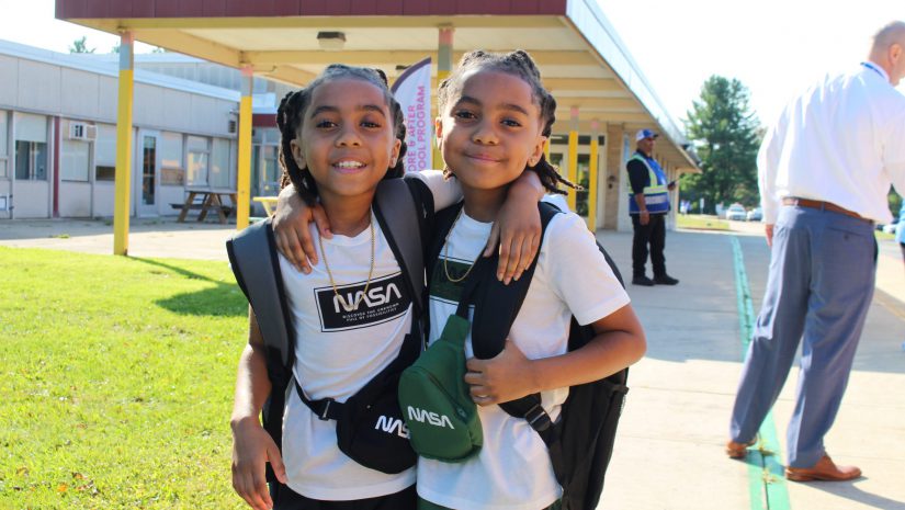 two students are posing