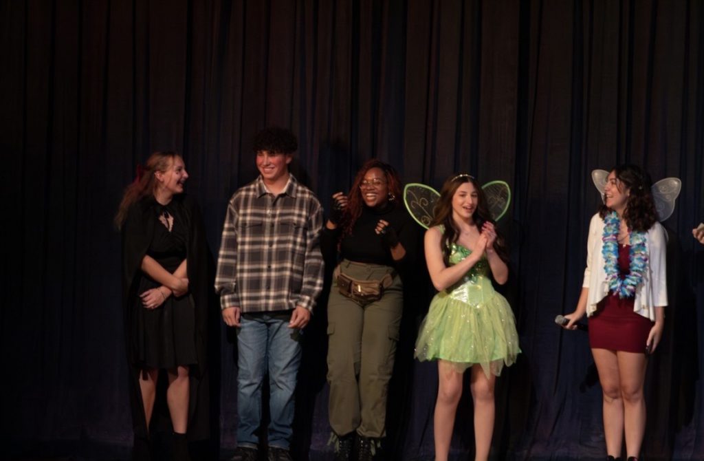 the students are lined up on stage during the Monti Idol performance.