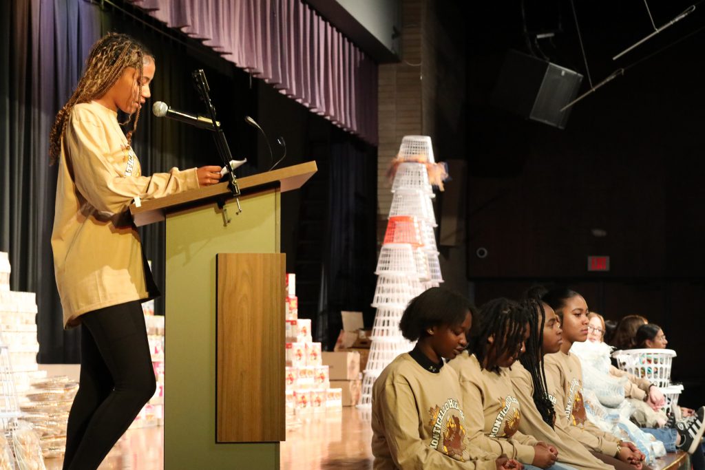 a student speaks at the podium