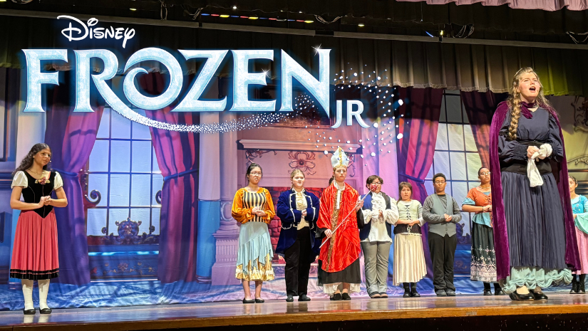 members of the cast of Frozen Jr. on stage