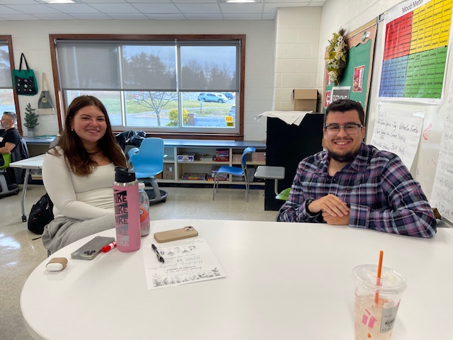 a student is posing with her mentor 