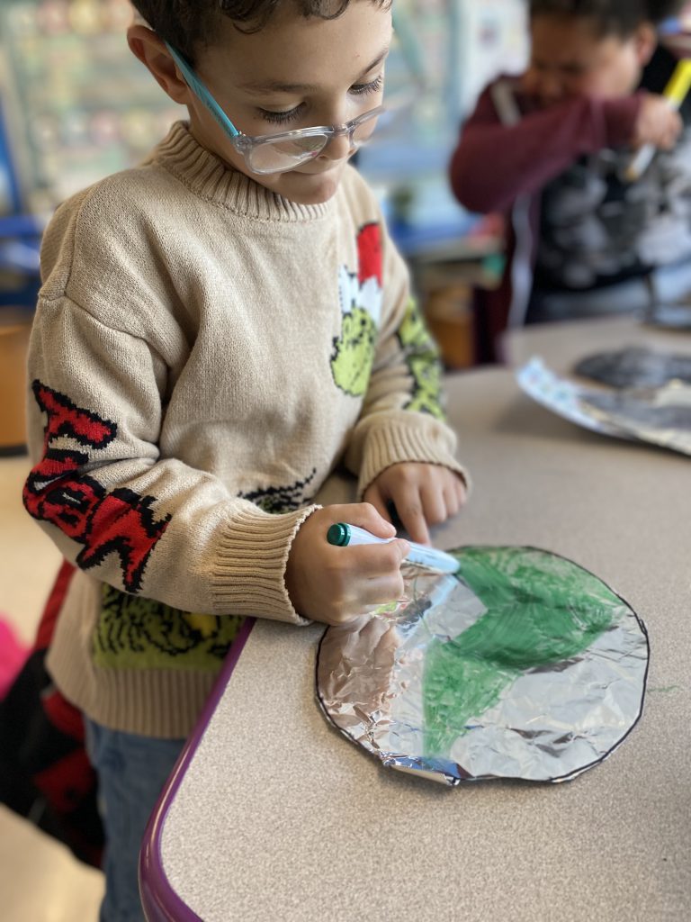 a student works on a balloon 