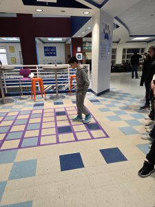 a student walks across a path