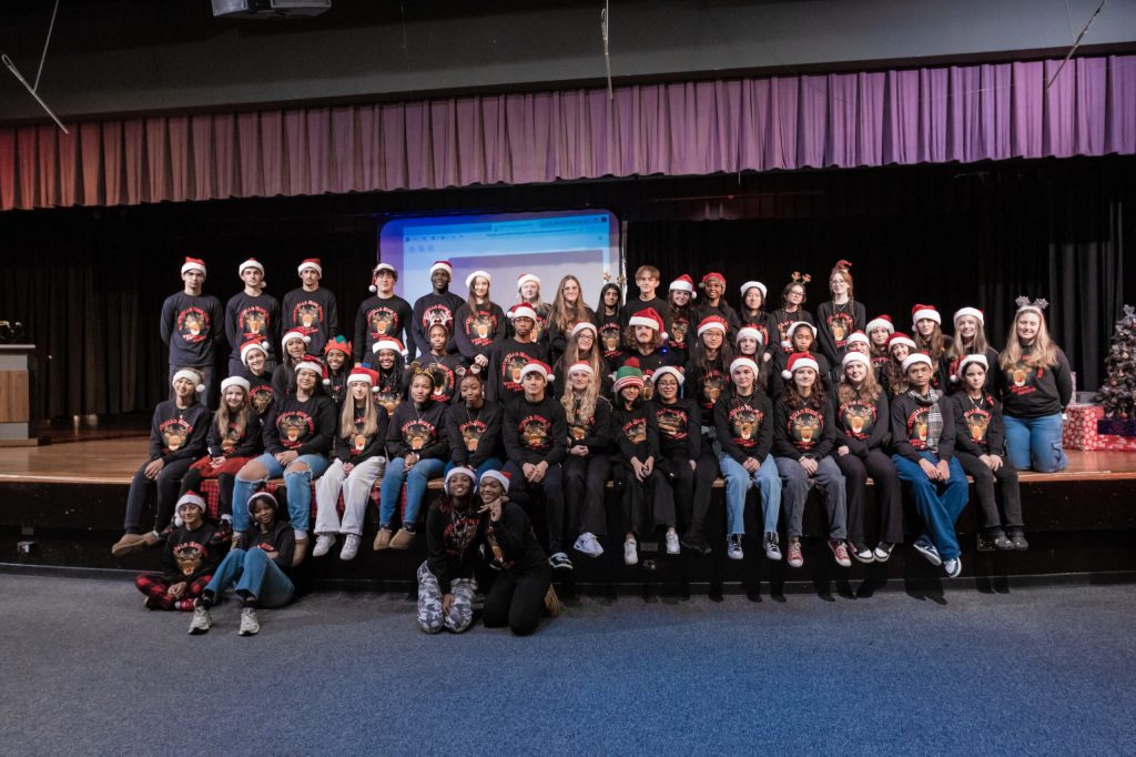 a group of students posing on stage