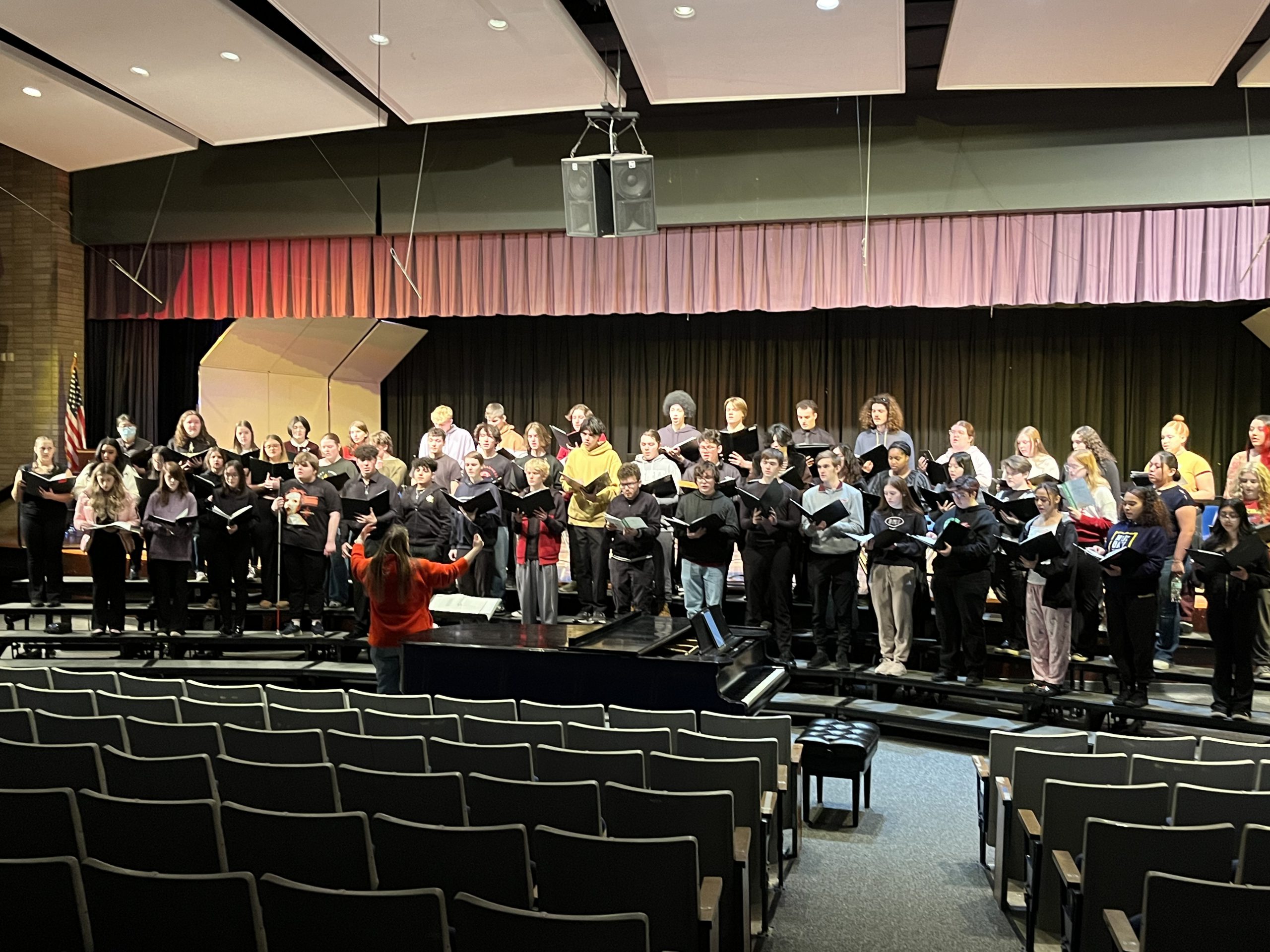 a group of students are performing on stage 