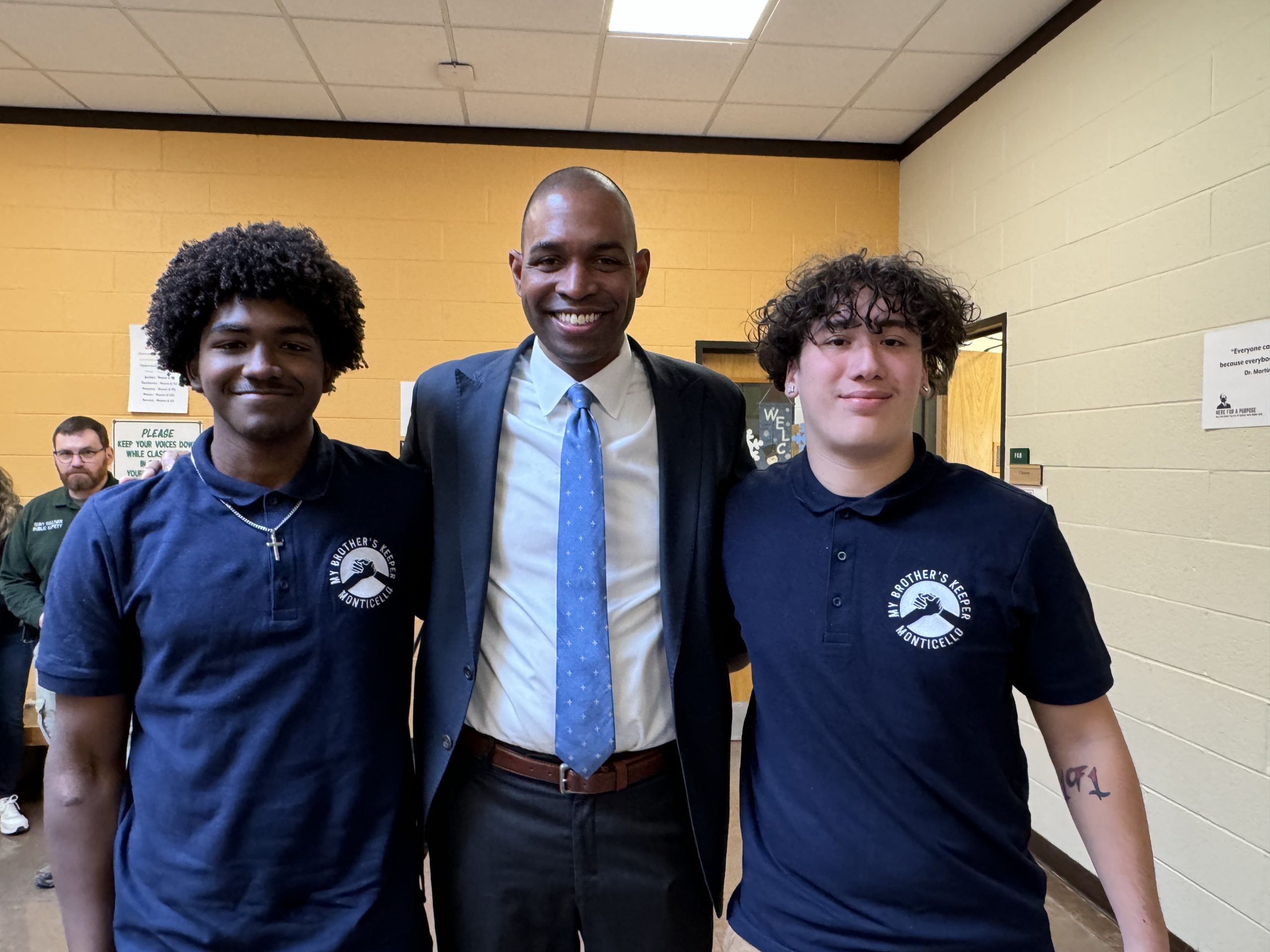 Antonio Delgado, center, poses with two MBK students